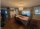 Traditional dining room with a chandelier, wood floors, and a decorative fireplace at 4208 Louisbury Rd, Wake Forest, NC 27587