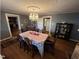 Cozy dining room with hardwood floors, a decorative chandelier, and elegant furnishings at 4208 Louisbury Rd, Wake Forest, NC 27587
