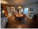 Cozy eat-in kitchen with wooden table, white appliances, and natural light at 4208 Louisbury Rd, Wake Forest, NC 27587