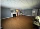 Spacious living room features a fireplace, wood floors, and natural lighting at 4208 Louisbury Rd, Wake Forest, NC 27587