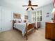 Bedroom with two twin beds, shutters, and American flag themed decor at 4210 Falls River Ave, Raleigh, NC 27614