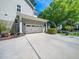 Spacious two-car garage with a concrete driveway and well-maintained landscaping at 4210 Falls River Ave, Raleigh, NC 27614