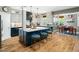 Well-designed kitchen with a spacious island and a dining area nearby at 4210 Falls River Ave, Raleigh, NC 27614