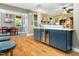 Kitchen with open floor plan features center island and bar area at 4210 Falls River Ave, Raleigh, NC 27614