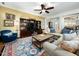 Spacious living room with hardwood floors, a large entertainment center, and comfortable seating at 4210 Falls River Ave, Raleigh, NC 27614
