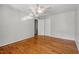 Spacious bedroom with hardwood floors, a ceiling fan, and closet space at 4318 Hunters Club Dr, Raleigh, NC 27606