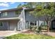 Charming townhome features a gray exterior, attached garage, and mature landscaping at 4318 Hunters Club Dr, Raleigh, NC 27606