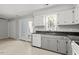Well-lit kitchen features granite countertops and stainless steel dishwasher, adding modern convenience and style at 4318 Hunters Club Dr, Raleigh, NC 27606