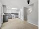 Spacious kitchen with white cabinets, modern appliances, and tile flooring at 4318 Hunters Club Dr, Raleigh, NC 27606