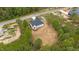 New house exterior with a gray roof, white siding, backyard wooden deck, and expansive backyard at 45 Leisure Ln # 4, Louisburg, NC 27549