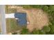 Aerial view of house with gray roof, green yard, a back porch, and long drive way at 45 Leisure Ln # 4, Louisburg, NC 27549