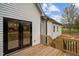 New construction house featuring black framed glass doors that lead to a wooden back porch at 45 Leisure Ln # 4, Louisburg, NC 27549
