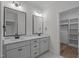 Bright bathroom with double sink, granite countertops, and modern fixtures and lighting at 45 Leisure Ln # 4, Louisburg, NC 27549