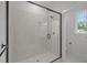Modern bathroom showcasing a glass-enclosed shower with white subway tile at 45 Leisure Ln # 4, Louisburg, NC 27549