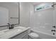 Well-lit bathroom featuring a marble countertop vanity and a shower-tub combo at 45 Leisure Ln # 4, Louisburg, NC 27549