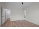 Bright bedroom features light flooring, ceiling fan, and two entrance doors at 45 Leisure Ln # 4, Louisburg, NC 27549