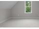 Bedroom with a window and plush carpet flooring at 45 Leisure Ln # 4, Louisburg, NC 27549