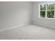 Bedroom with natural light streaming through the window at 45 Leisure Ln # 4, Louisburg, NC 27549