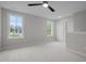 Bedroom with two large windows and a door leading to other rooms at 45 Leisure Ln # 4, Louisburg, NC 27549