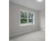 Bright bedroom with a large window offering views of the surrounding greenery at 45 Leisure Ln # 4, Louisburg, NC 27549