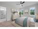Bright bedroom with large windows and ensuite bath, offering a relaxing private retreat at 45 Leisure Ln # 4, Louisburg, NC 27549