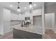 Bright kitchen features stainless appliances, white cabinets, granite counters, and modern lighting at 45 Leisure Ln # 4, Louisburg, NC 27549