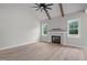 Bright living area features a fireplace, vaulted ceiling, and seamless flow into the kitchen at 45 Leisure Ln # 4, Louisburg, NC 27549