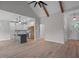 Bright living area features a fireplace, vaulted ceiling, and seamless flow into the kitchen at 45 Leisure Ln # 4, Louisburg, NC 27549