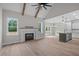 Bright living area features a fireplace, vaulted ceiling, and seamless flow into the kitchen at 45 Leisure Ln # 4, Louisburg, NC 27549