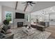 Open-concept living area features a fireplace, vaulted ceiling, and seamless flow into the kitchen at 45 Leisure Ln # 4, Louisburg, NC 27549