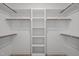 Organized walk-in closet features shelving and racks at 45 Leisure Ln # 4, Louisburg, NC 27549