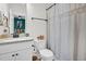 Bathroom featuring light countertops, vanity, toilet, shower with curtain and mirror at 4816 Heathshire Dr, Raleigh, NC 27616