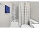 Clean, white bathroom with modern fixtures and a shower featuring marble-tile surround at 4816 Heathshire Dr, Raleigh, NC 27616