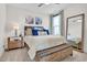 Spacious bedroom with king bed, carpeted floors, large mirror and neutral color palette at 4816 Heathshire Dr, Raleigh, NC 27616