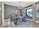 Stylish dining room showcasing a modern chandelier, rustic table, and elegant decorative accents at 4816 Heathshire Dr, Raleigh, NC 27616