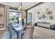 Bright dining room with stylish lighting, a rustic table setting, and contemporary decor at 4816 Heathshire Dr, Raleigh, NC 27616