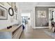 Elegant foyer with stylish decor, hardwood floors, and a view into the adjacent living spaces at 4816 Heathshire Dr, Raleigh, NC 27616