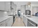 Modern kitchen with stainless appliances, sleek cabinets, and marble countertops at 4816 Heathshire Dr, Raleigh, NC 27616
