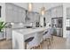 Modern kitchen featuring stainless steel appliances, a center island with seating, and ample cabinet space at 4816 Heathshire Dr, Raleigh, NC 27616