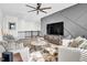 Upstairs living area with modern furniture and a ceiling fan for added comfort at 4816 Heathshire Dr, Raleigh, NC 27616