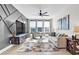 Bright living room with large windows, modern furniture, and contemporary decor at 4816 Heathshire Dr, Raleigh, NC 27616