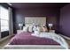 Stylish main bedroom featuring neutral headboard, side tables with lamps, and beautiful accent pillows at 4816 Heathshire Dr, Raleigh, NC 27616