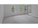 Spacious bedroom featuring two windows and a mirrored closet at 497 Summerwalk Cir # 497, Chapel Hill, NC 27517