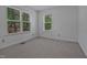 Bedroom featuring two large windows bringing in natural light and neutral carpeting at 497 Summerwalk Cir # 497, Chapel Hill, NC 27517