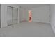 A bright bedroom with carpet, fresh white walls, and a mirrored closet, adjacent to the bathroom at 497 Summerwalk Cir # 497, Chapel Hill, NC 27517