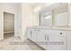 Bright bathroom featuring a double vanity with modern fixtures and a well-lit mirror, offering both style and functionality at 5516 Jaeger Dr # 75, Graham, NC 27253