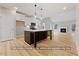 Modern kitchen featuring a center island, white cabinets, and stainless steel appliances at 5516 Jaeger Dr # 75, Graham, NC 27253