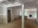 Unfinished living room with a fireplace, windows and doorway at 5516 Jaeger Dr # 75, Graham, NC 27253