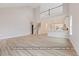 Open-concept living room showcasing hardwood floors and a staircase to the second floor at 5516 Jaeger Dr # 75, Graham, NC 27253