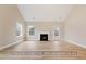 Bright living room featuring hardwood floors, a fireplace, and natural light at 5516 Jaeger Dr # 75, Graham, NC 27253